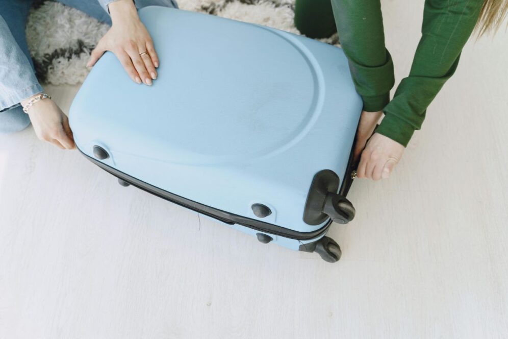 People packing suitcase for comfortable travel