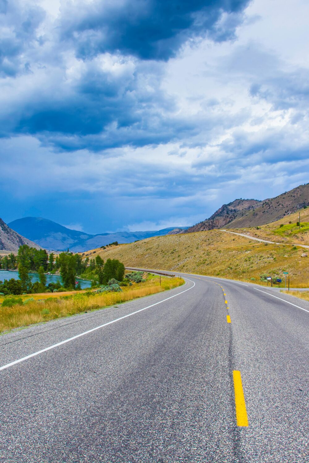 Scenic highway through mountain valley landscape.