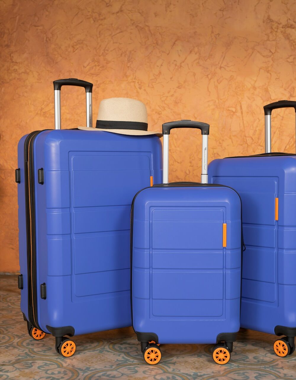 Blue luggage set ready for travel.